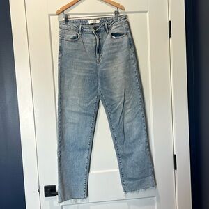 Soft straight leg jeans with unfinished hem on bottom